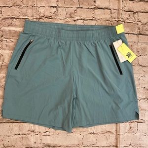 NWT all in motion teal blue shorts. A stretchy size L.